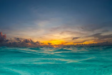 Zelfklevend Fotobehang A sunrise shot over the water of the Caribbean Sea © drew