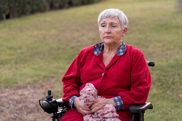 portrait of a senior caucasian woman in wheelchair, sad expression