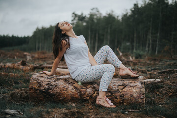 a photo of woman in the forest where the purple heather blooms. copy space. authentic image.