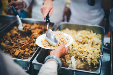 Concept of feeding and sharing : Providing free food for the poor hunger