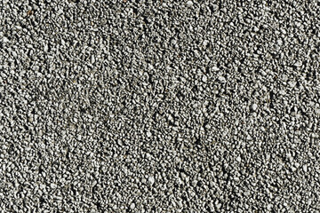 Gravel texture. Small rocks grain pattern for graphic design. Little stones background. Gray noise backdrop.