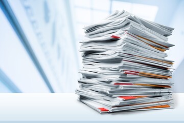 File folders with documents on white table