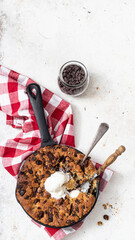 Giant skillet cookie with chocolate chips and ice cream