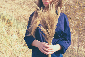 Concept of autumn time and fall season coming. Horizontal toned photo of cute young woman with...