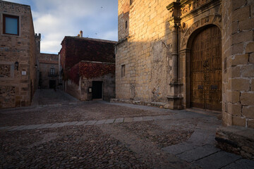 Fototapeta na wymiar Street of the monumental old town of Cáceres city at sunset, UNESCO World Heritage City, Extremadura, Spain
