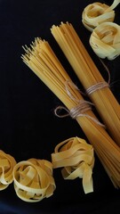 Spaghetti paste on a dark background top view