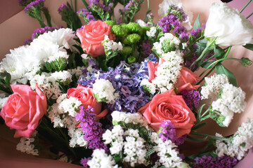 Bouquet of different flowers close up. Light photo