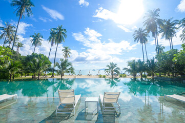 Fototapeta na wymiar Beautiful view of swimming pool with Green tropical garden in cozy resort, phi phi island, Thailand