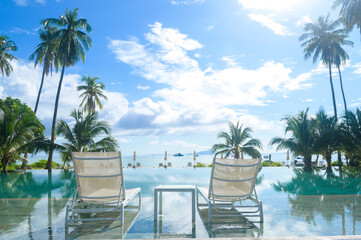 Fototapeta premium Beautiful view of swimming pool with Green tropical garden in cozy resort, phi phi island, Thailand