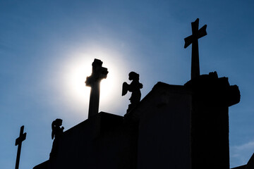 Silhouette of crosses in a cemetery