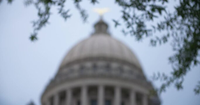 Rack focus out and in: Stormy skies over the Mississippi State Capitol building. Jackson, MS.