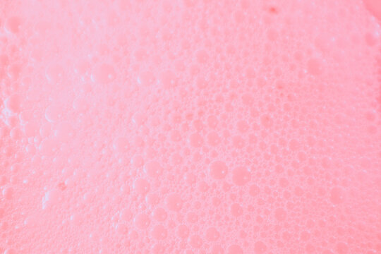 Beautiful pink soap bubbles background, orange and white foam bubble texture