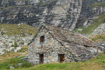 Traditional farmhouse built from boulders found on site, Schwarzi Balma, Wallis, Switzerland