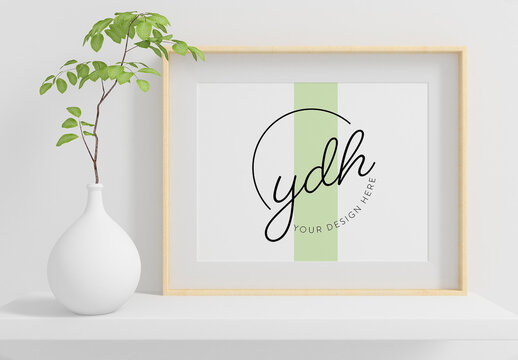 Horizontal Frame on a Shelf with Plant Mockup 