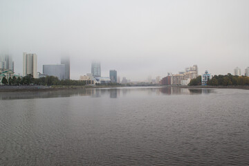 city embankment in the fog