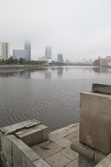 city embankment in the fog