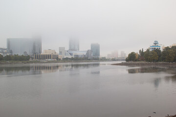 city embankment in the fog