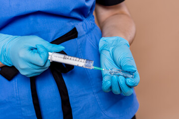 Hands close-up when preparing an injection