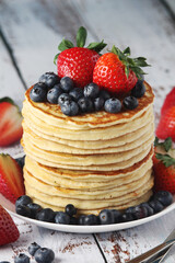 A stack if home-made pancakes with berry
