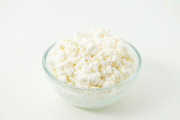 A glass bowl with cotton cheese