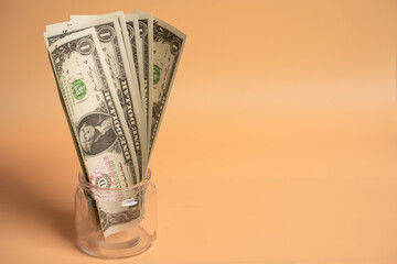 Dollar money placed on orange background