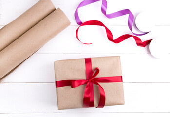 Fototapeta premium Packed eco gifts on a wooden background