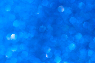 abstract blue bokeh background from glitter