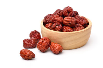 Dried red date or Chinese jujube fruits in wooden bowl isolated on white background.