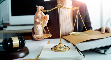 Business and lawyers discussing contract papers with brass scale on desk in office. Law, legal...
