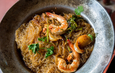 Baked prawn with Glass Noodles and chinese sauce, yummy mixed thai and china cuisine " Kung Ob Woon Sen". imagr for background, wallpaper and menu list.