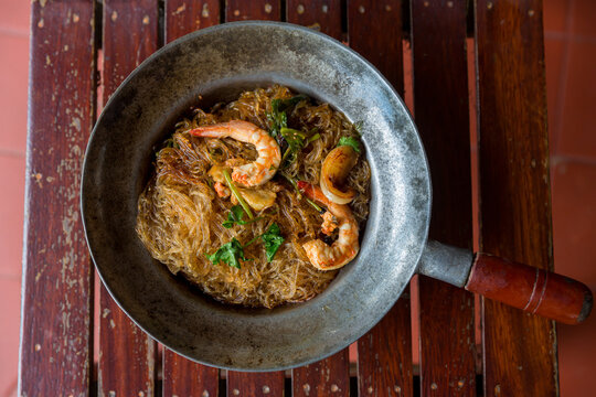 Baked prawn with Glass Noodles and chinese sauce, yummy mixed thai and china cuisine " Kung Ob Woon Sen". imagr for background, wallpaper and menu list.