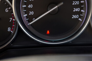 Seat belt icon on car dashboard. The symbol on the dashboard of the car: the non-fastened seat belt.  Seat belt icon on the dashboard of a car