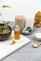 Bottle natural organic oil essence serum with healing herbs and sea salt. Aromatherapy and beauty. Concept set of harmony, balance and meditation, spa, massage, relax, beauty spa treatment.