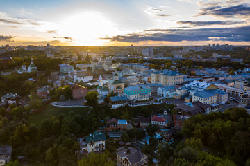 panoramic view of the old city district with old buildings and a church filmed from a drone