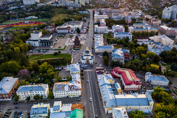 panoramic view of the old city district with old buildings and a church filmed from a drone