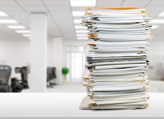 Stack of document papers on office background