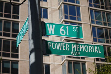 Fototapeta na wymiar West 61st Street ann Power Memorial Way sign