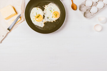 Flat lay composition fried eggs in frying pan