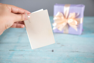 Obraz premium woman hand card and gift box