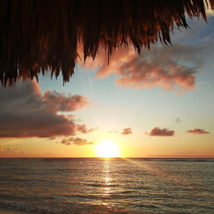 sunrise under gazebo on the beach