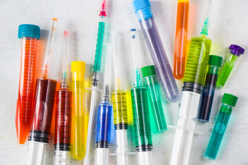 Colorful medical needle with chemical drugs and vaccine © taidundua