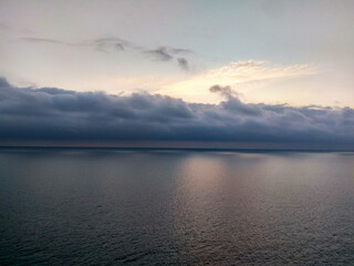 cloudy sunrise in the middle of the sea