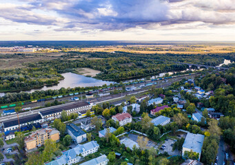 a panoramic view of the old city district with ancient buildings and a church filmed from a drone