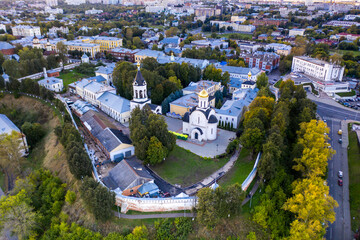 a panoramic view of the old city district with ancient buildings and a church filmed from a drone