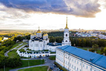 a panoramic view of the old city district with ancient buildings and a church filmed from a drone
