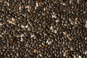 Macro photo of Raw chia seeds texture for supplement and diet product concept. Food background of Chia seeds