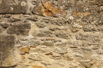 Texture of an old wall made of stones - background photo