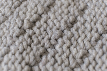 Handmade grey knitting wool texture background close up