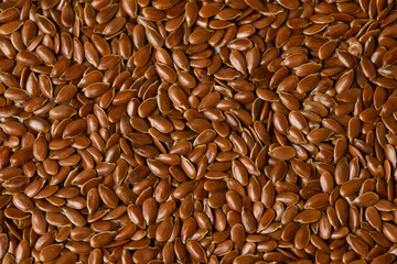 Macro photo of Raw flax seeds texture for Superfood and diet product concept. Food background of flaxseed - obrazy, fototapety, plakaty