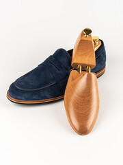 Wooden shoe lasts on a white background.	